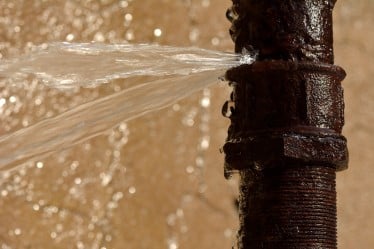 commercial pipe damaged and leaking water